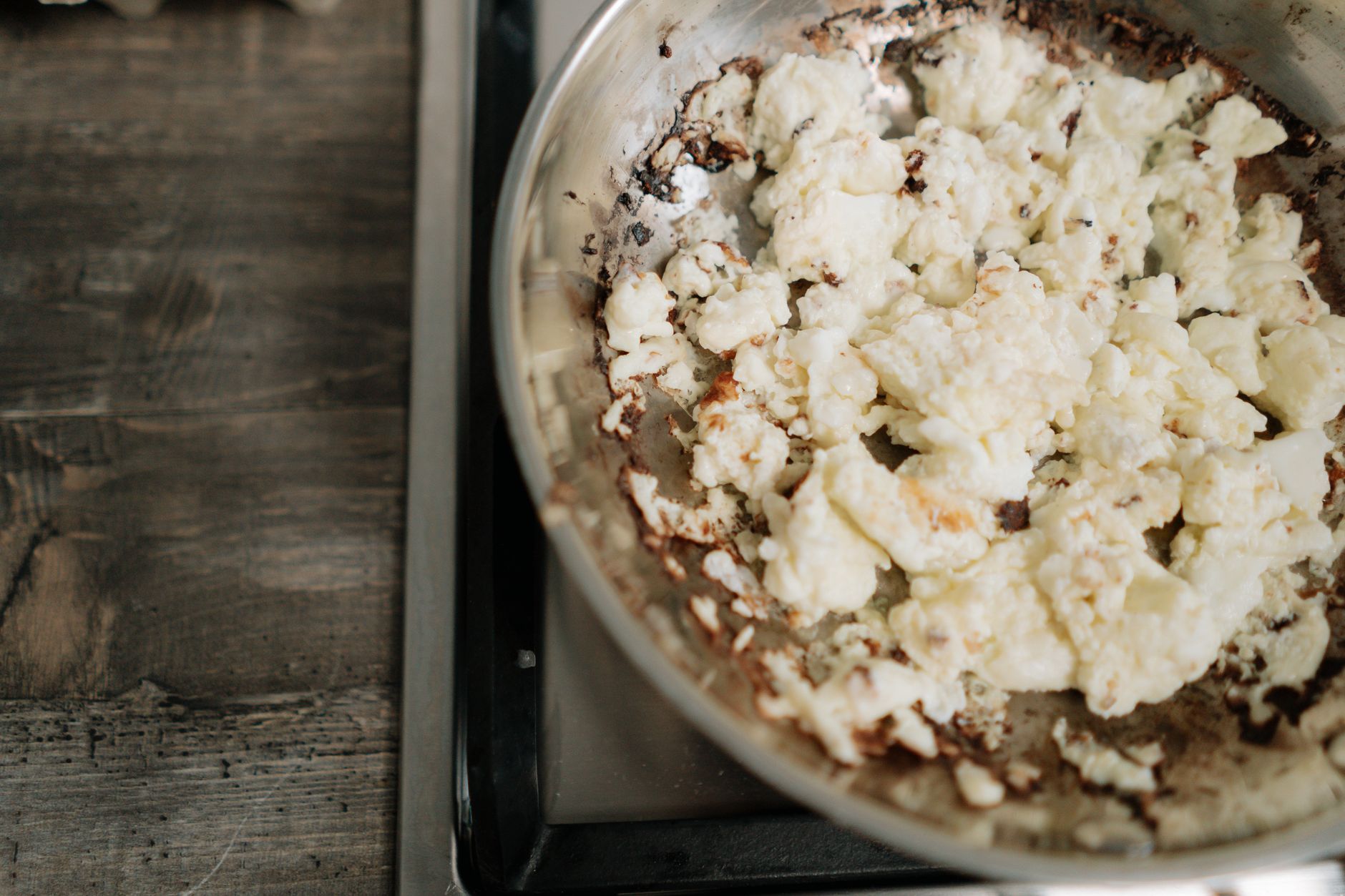Close-up of whey protein powder being mixed into a batter, with a focus on its texture and consistency.