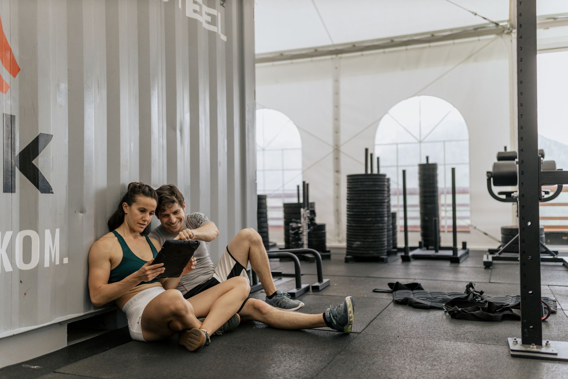 Lifter resting between sets in a gym