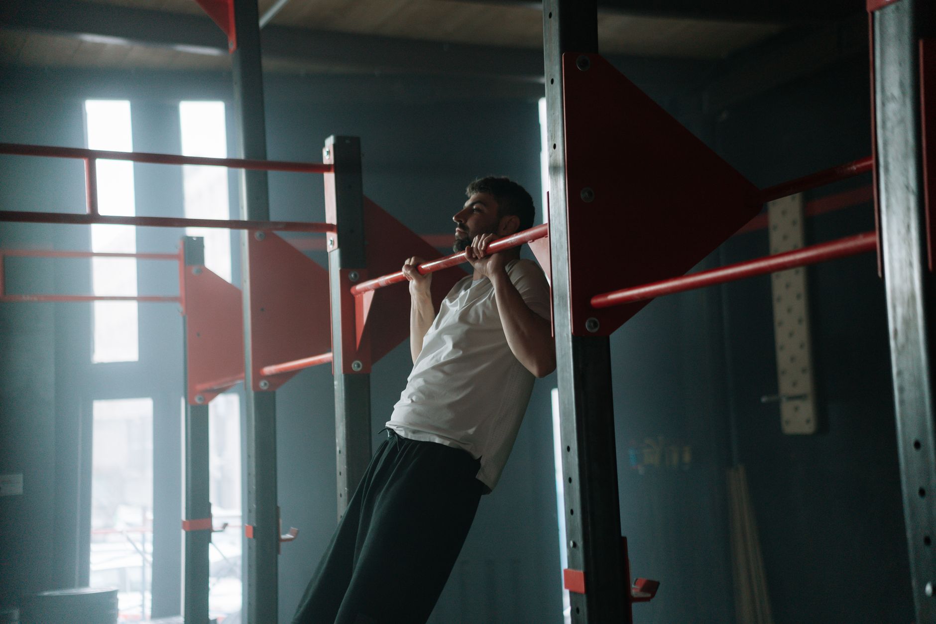 A man performing a strict pull-up with good form.